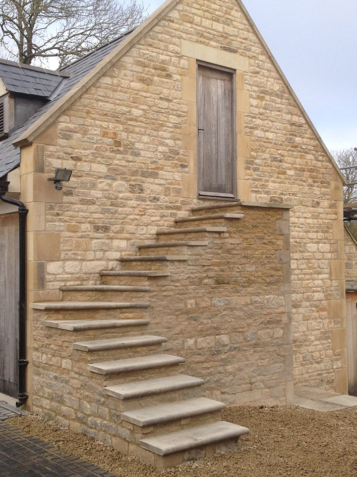 Cotswold stonemasonry with traditional stonework and lime mortar detailing