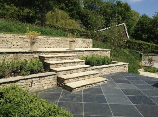 Landscaping project by Davenports in Stroud, featuring natural stonework and garden construction. Stroud landscaping project with natural stone patio and garden construction by Davenports